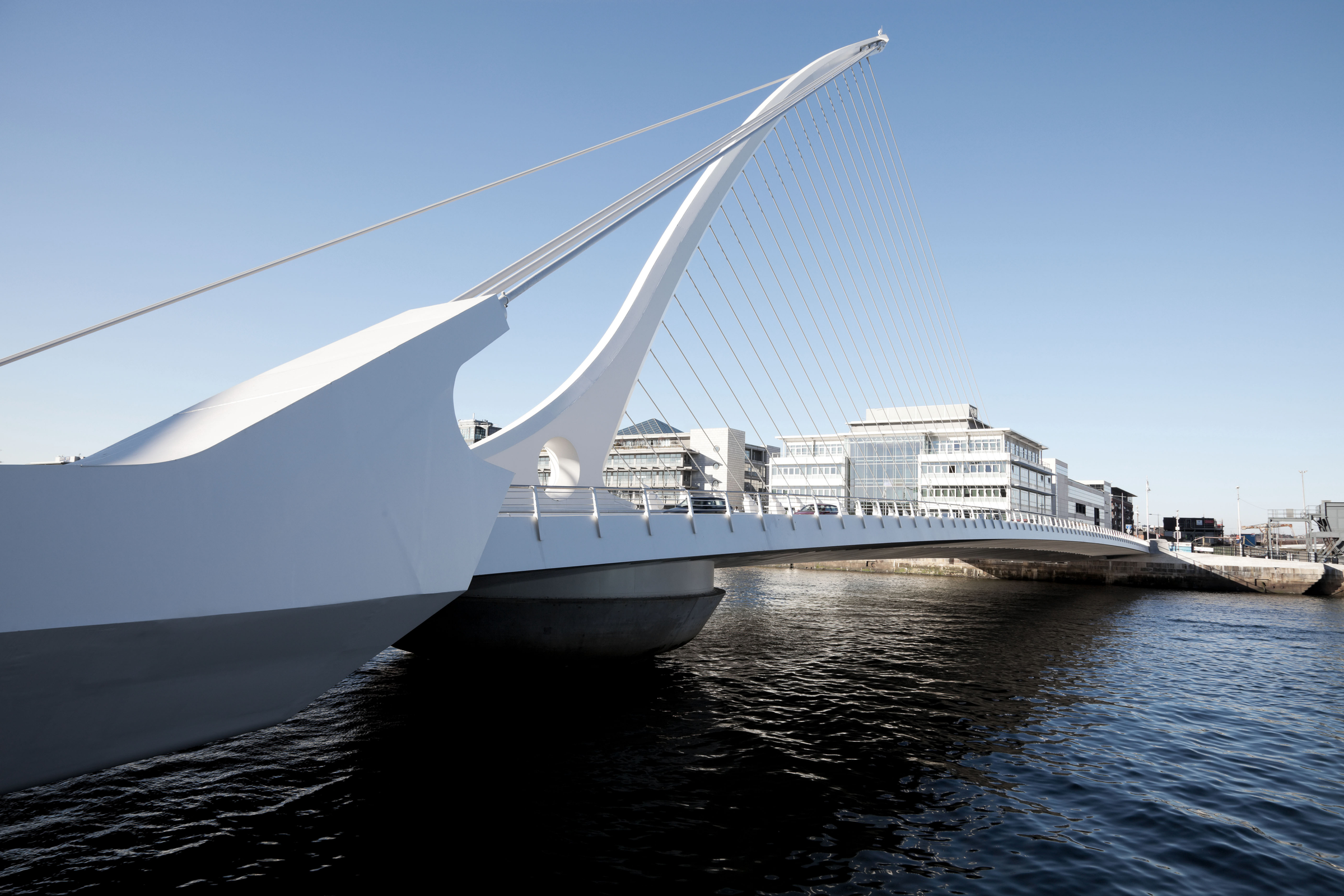 View showing the recently opened Samuel Beckett Bridge linking the northside and southside of Dublin across the River Lffey, down by the doclands. It is meant to represent a harp on its side, which is a traditional sign of Ireland and is named after a famous irish writer.. Taken with Canon 5D Mark2