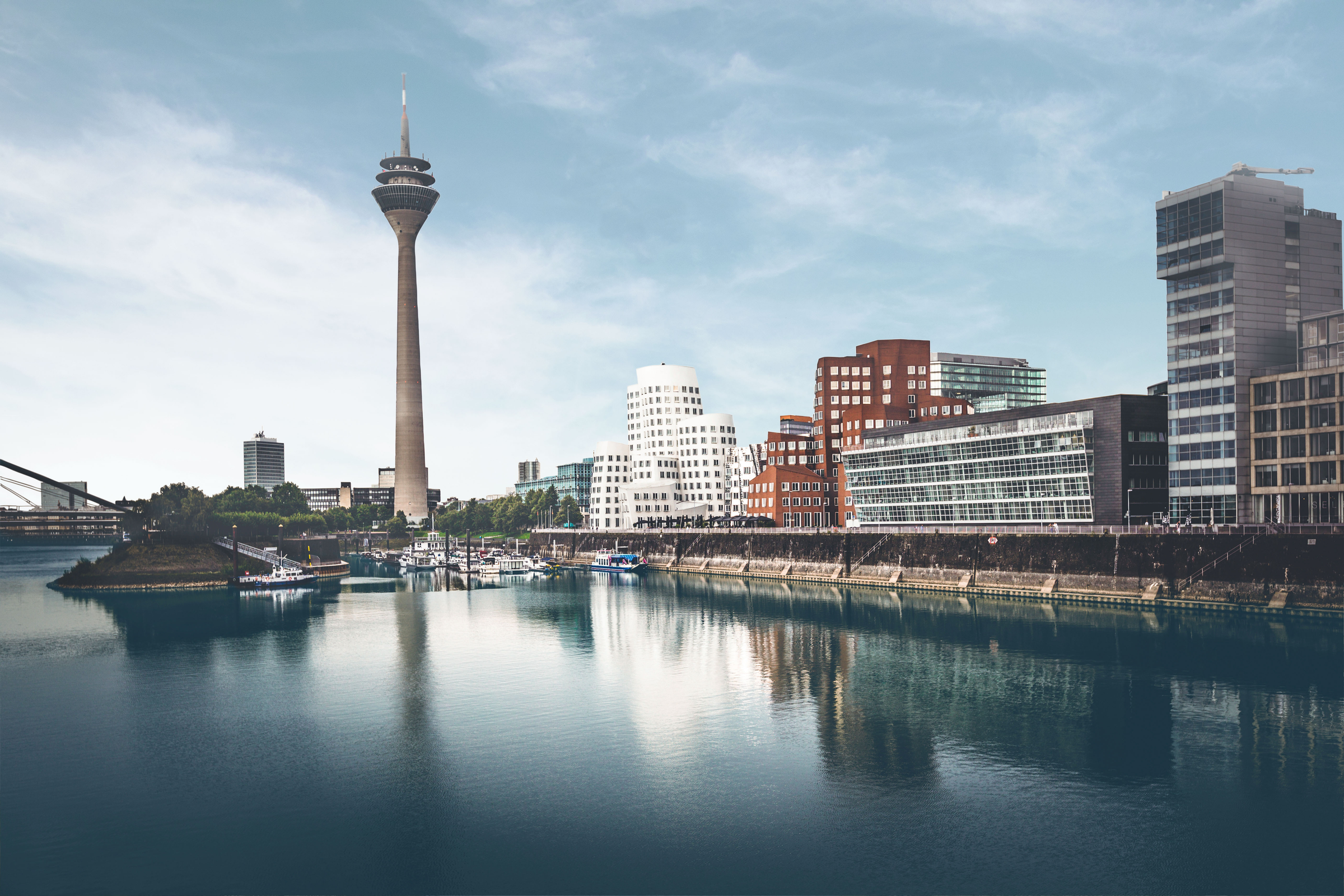 duesseldorf tv tower and media harbor skyline under dramatic sky, germany.