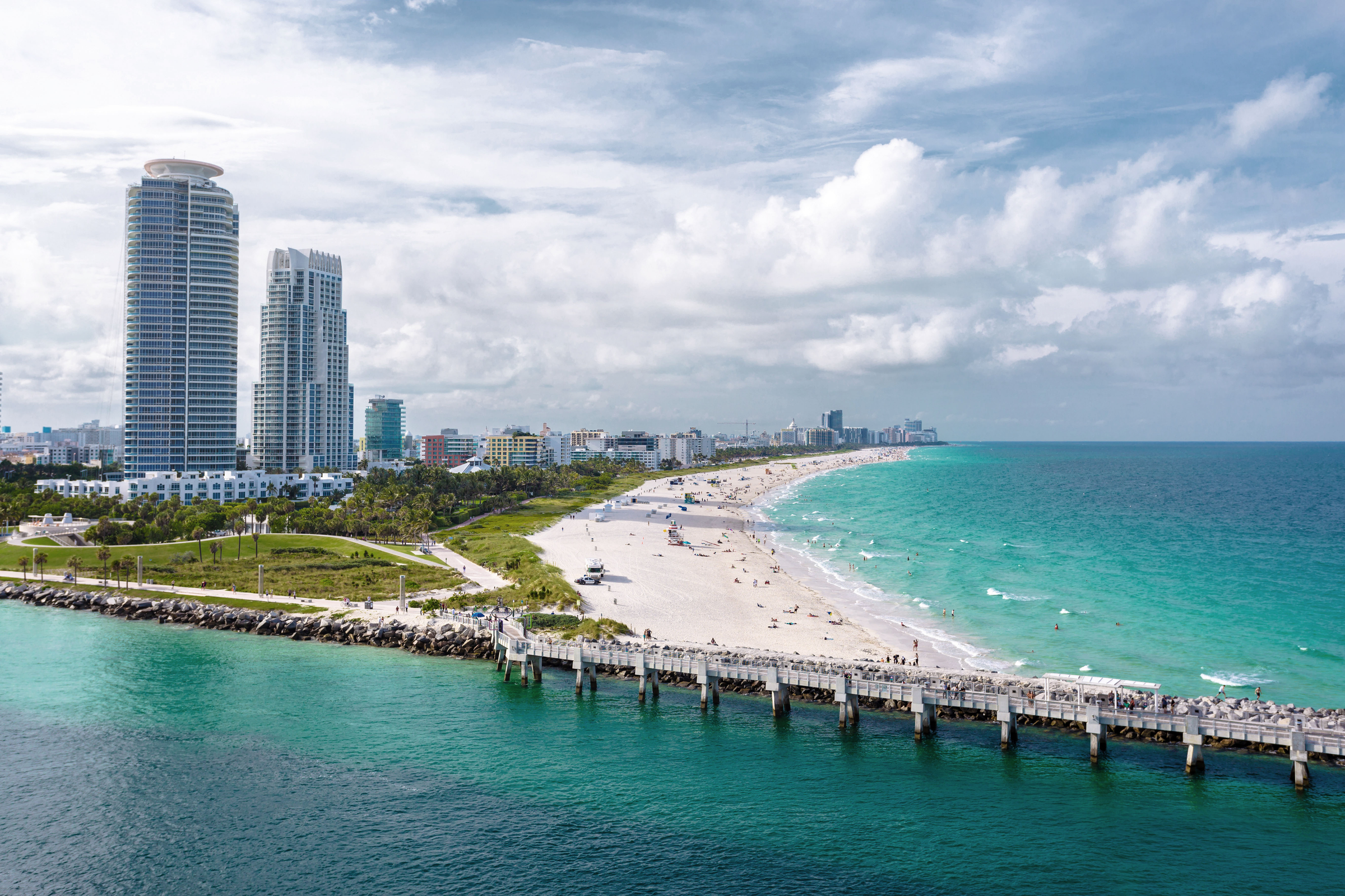 Panoramic view of South Beach at Miami South Pointe Park with high skyscrapers and a blue sunny summer sky, Florida, USA on a cruise day.