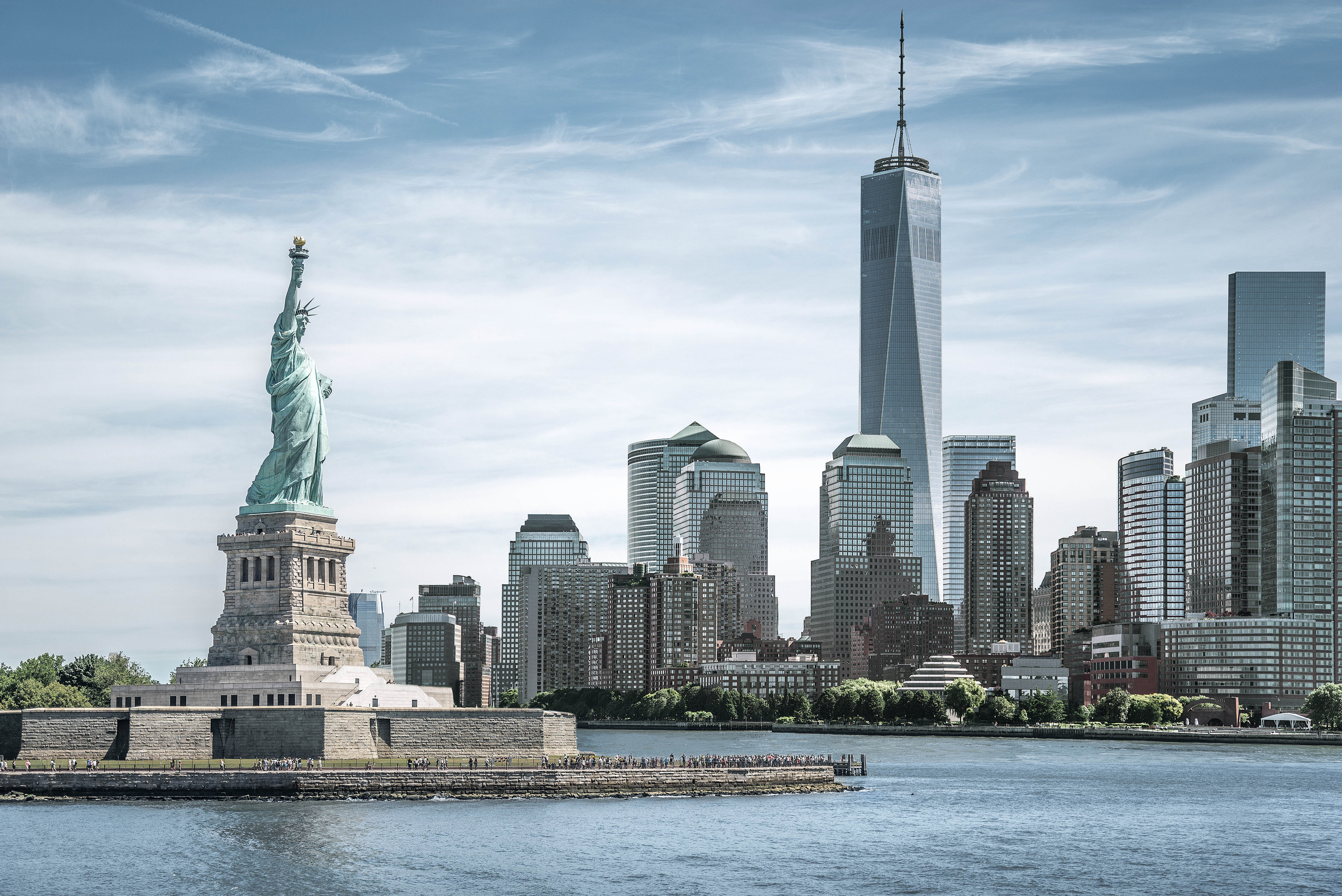 The Statue of Liberty with One World Trade Center background, Landmarks of New York City, USA