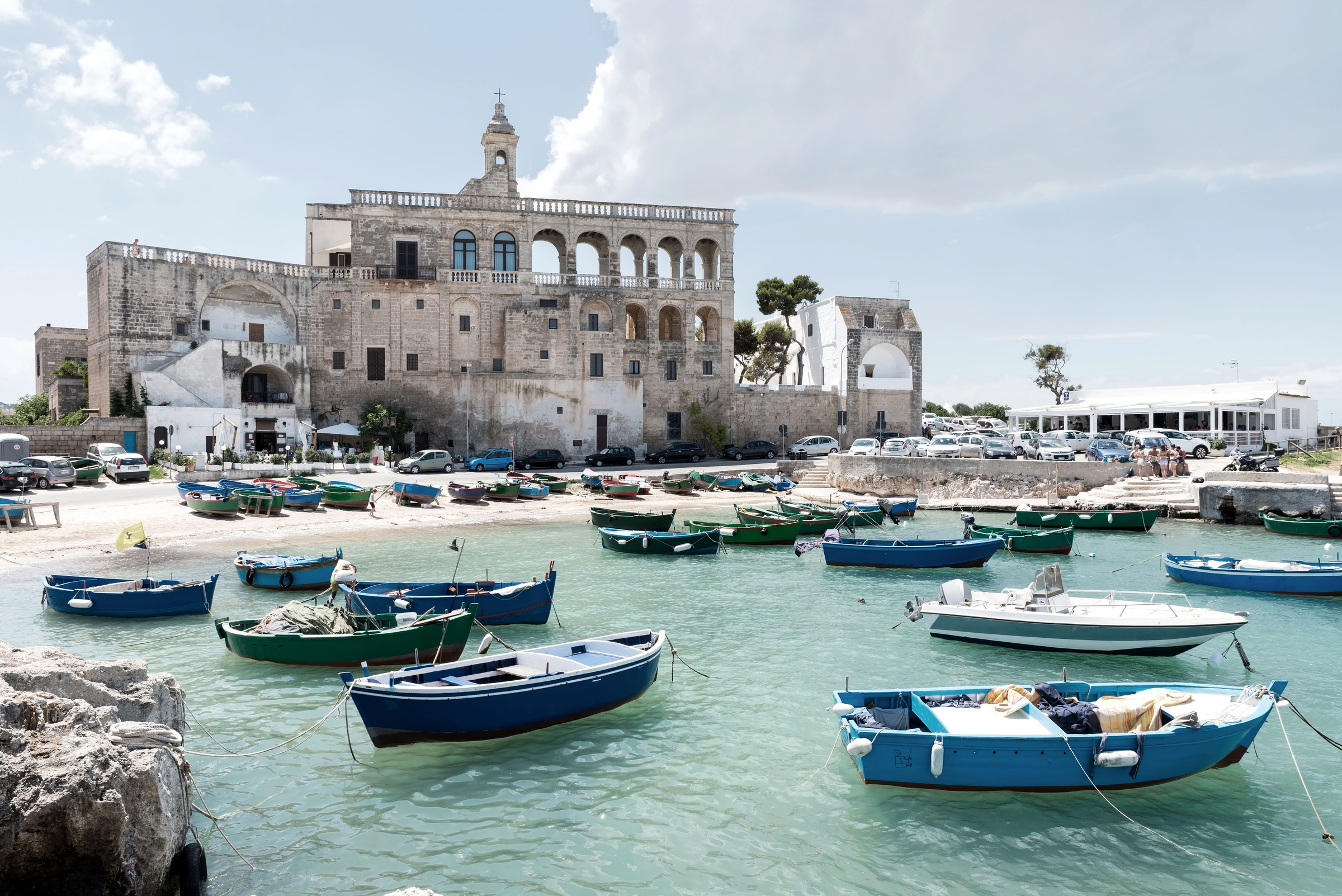 San Vito port with old abbaye in the background dating 16th century abbey. Polignano a Mare, Bari province, Puglia, Italy