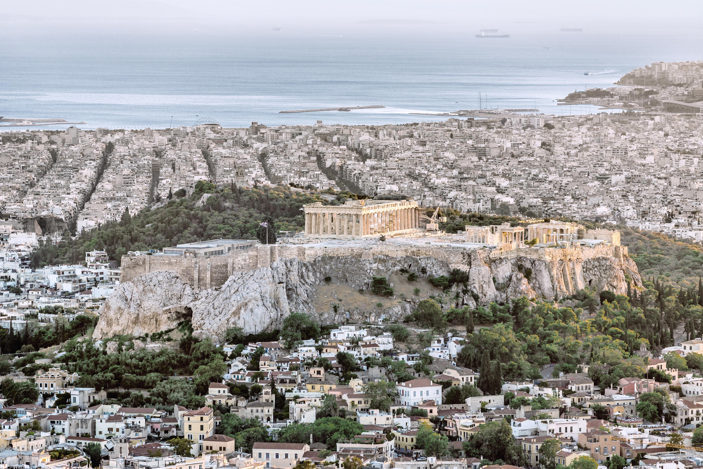 Aerial view over the City of Athens with famous Acropolis at Sunset. Athens, Greece.