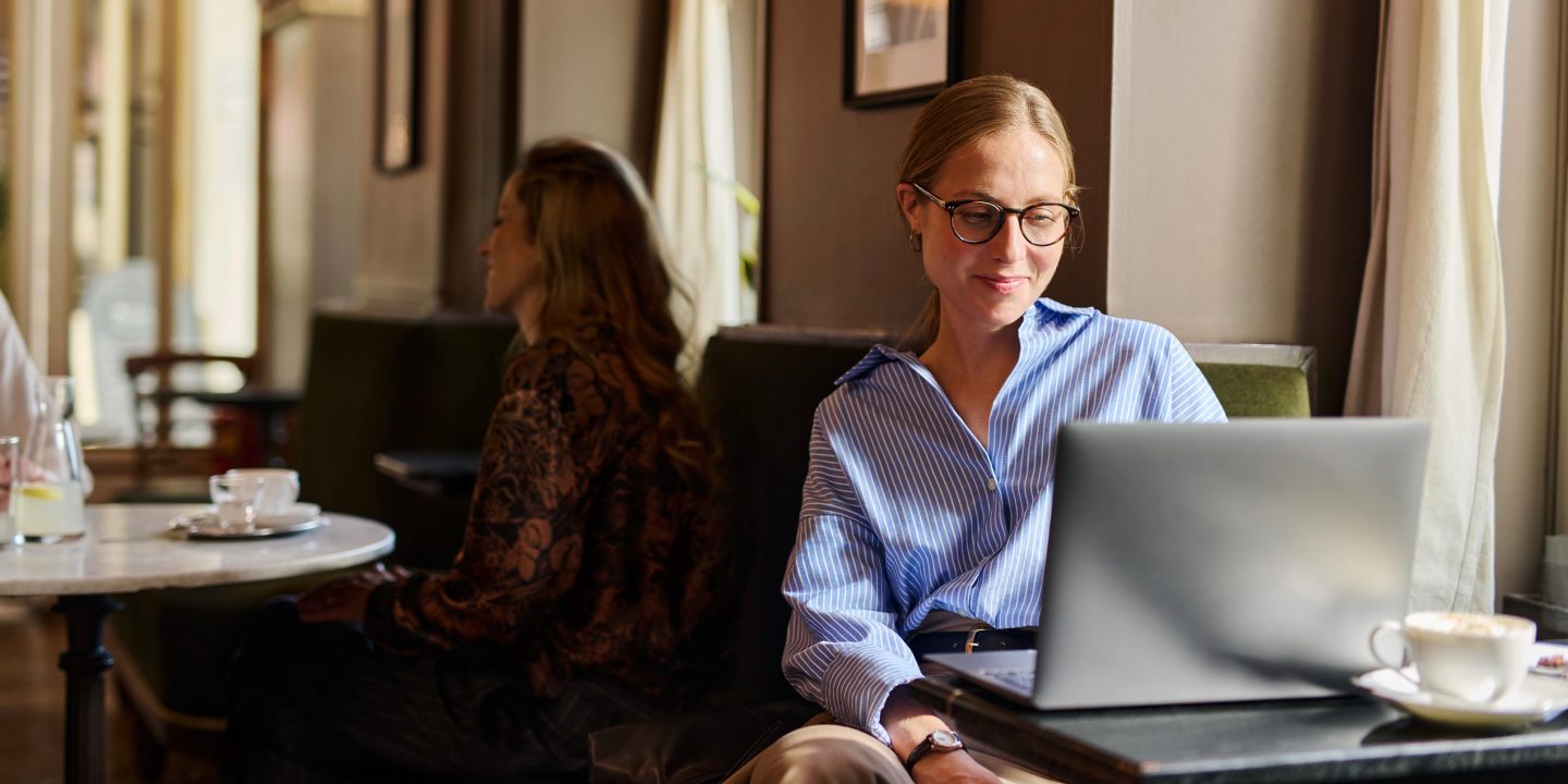 Woman checks in on his laptop