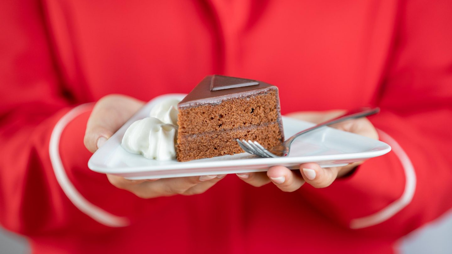 Plate with chocolate cake and cream.