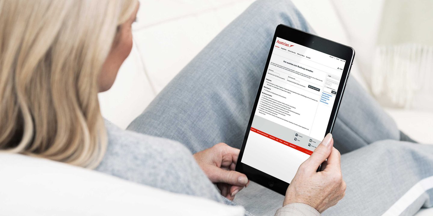 A woman using the Austrian My Bookings website on her tablet