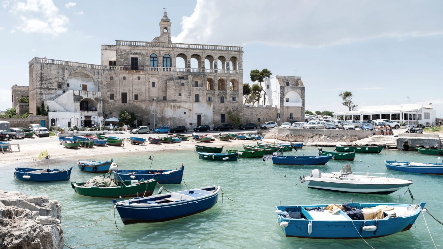 San Vito port with old abbaye in the background dating 16th century abbey. Polignano a Mare, Bari province, Puglia, Italy