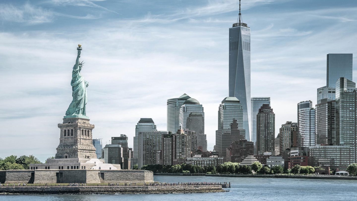 The Statue of Liberty with One World Trade Center background, Landmarks of New York City, USA