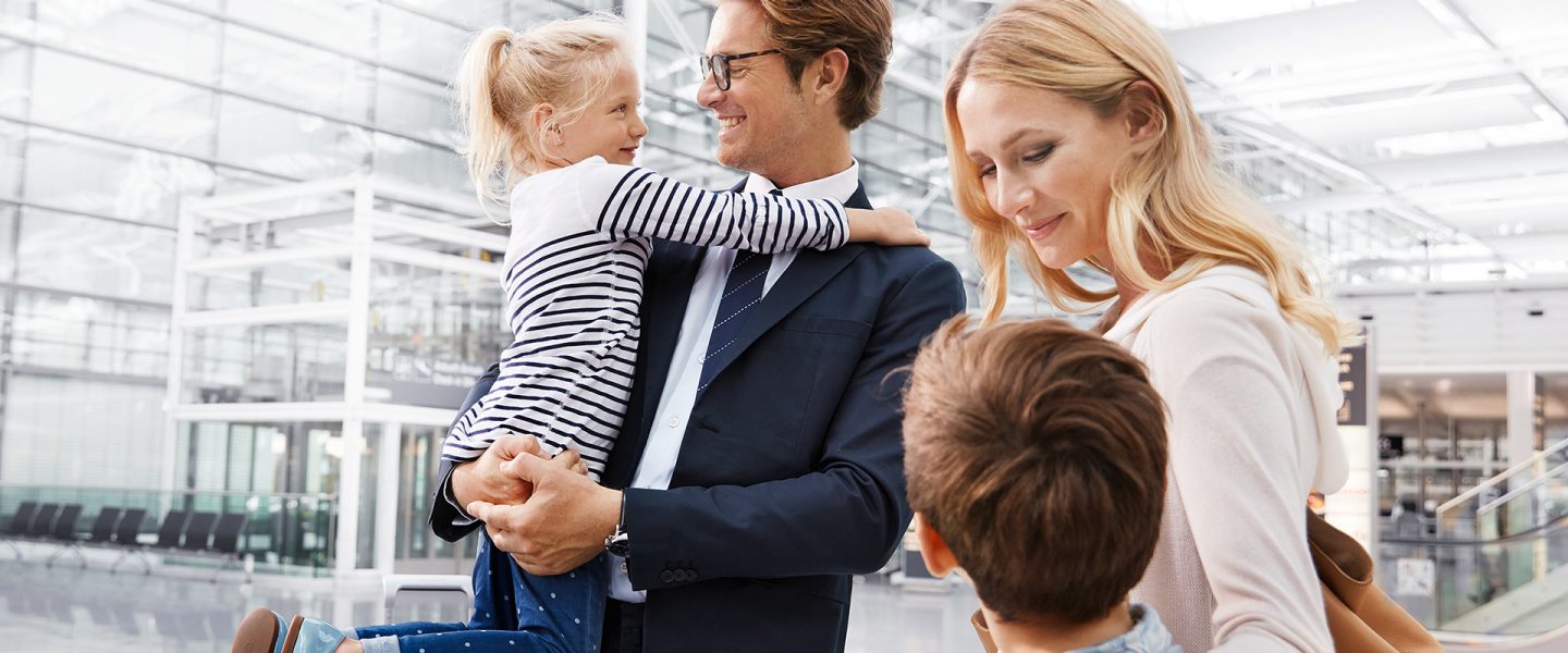 Family with two children at the airport