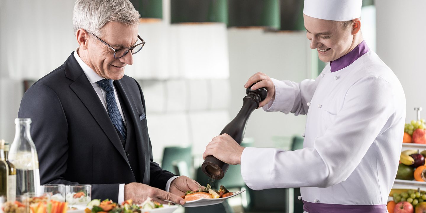 A business man enjoying the exclusive kitchen in the Austrian lounges